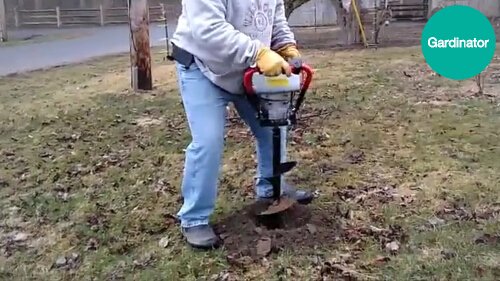 using small one man auger to dig holes